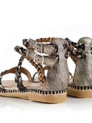 sandalias bajas de cuero trenzado negro y dorado